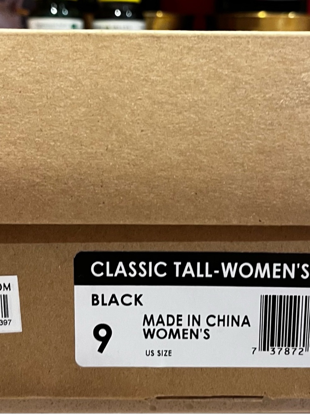 UGG Black Classic Medium boot. See flaws.